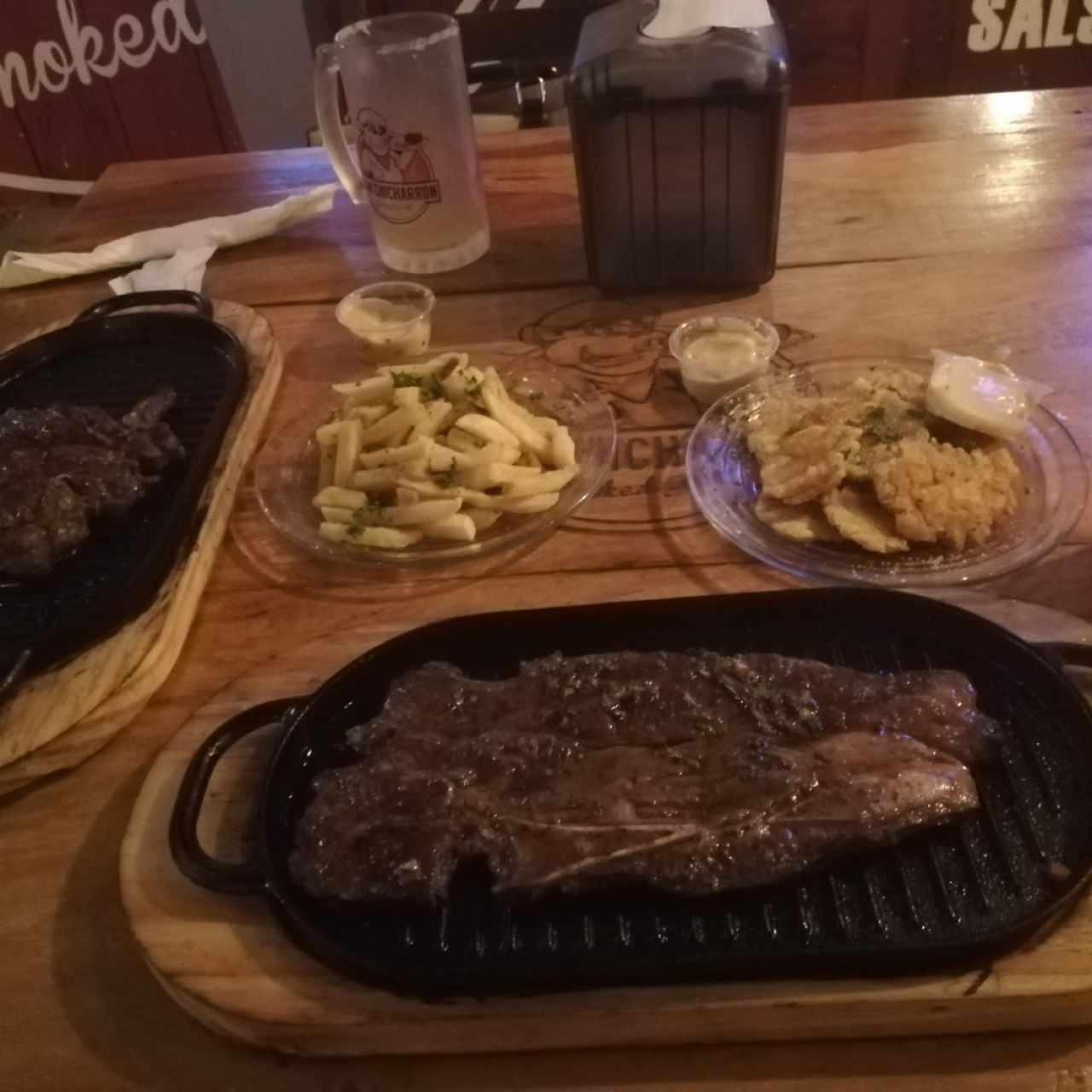 churrasco con patacones y rib eye paps fritas