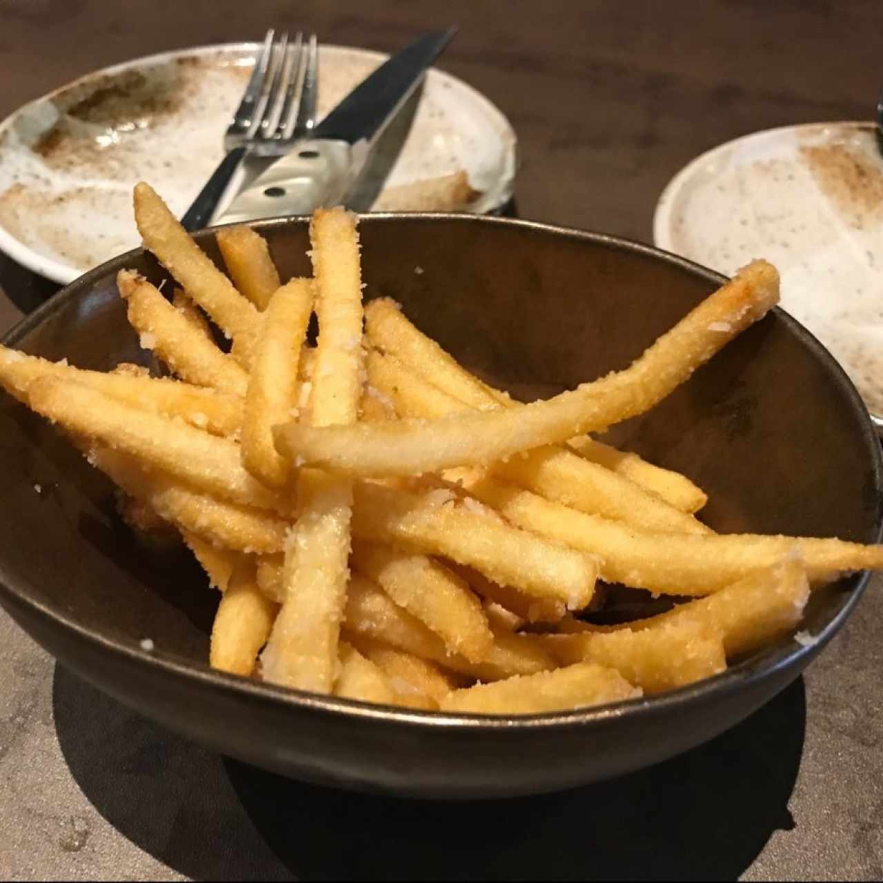 Papas francesas con perfume de trufas y Granna Padano