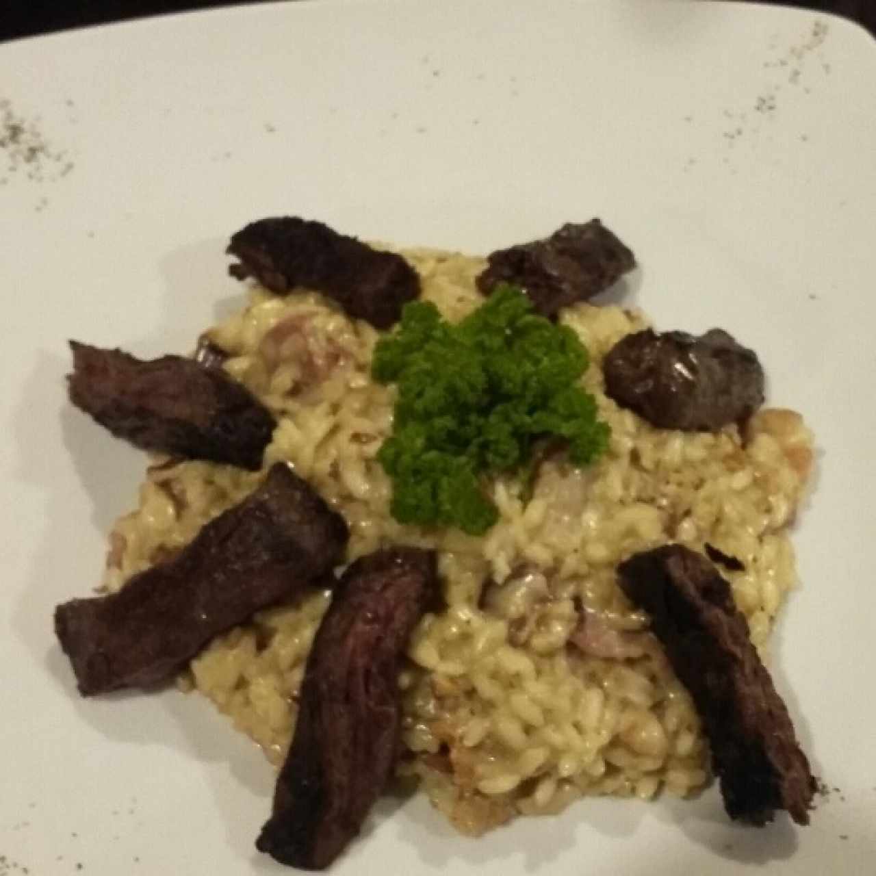 risotto con tocineta y carne angus