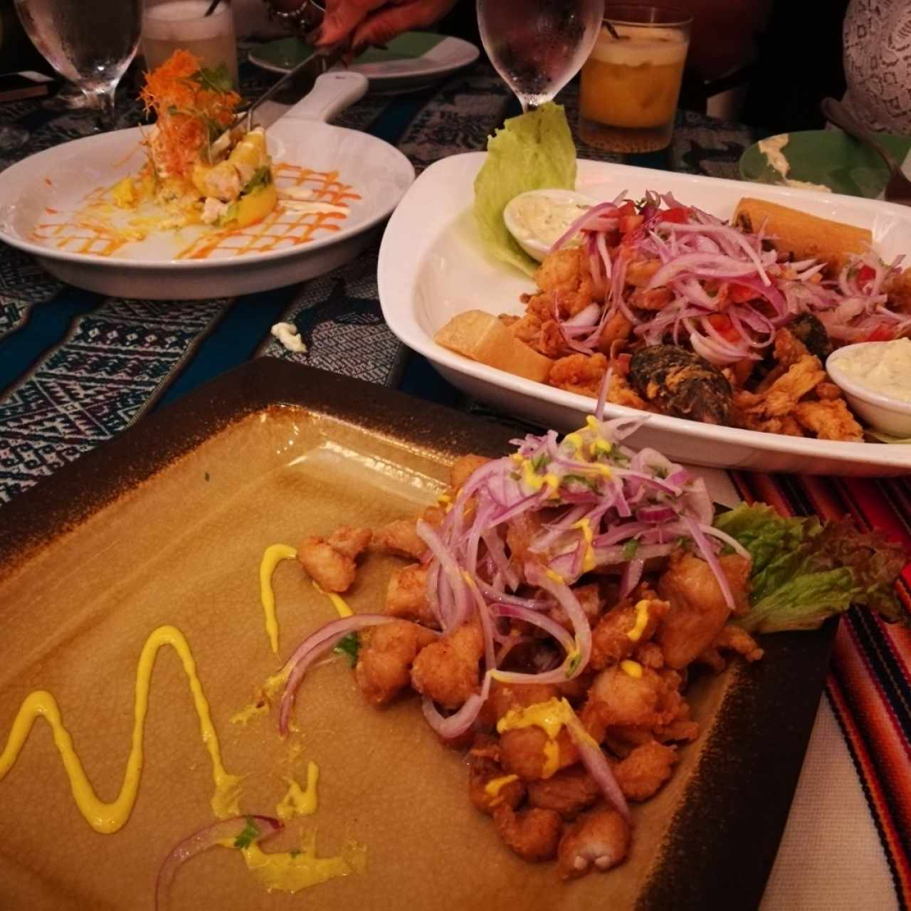 Causa de pollo, jalea de mariscos y ceviche de corvina frito