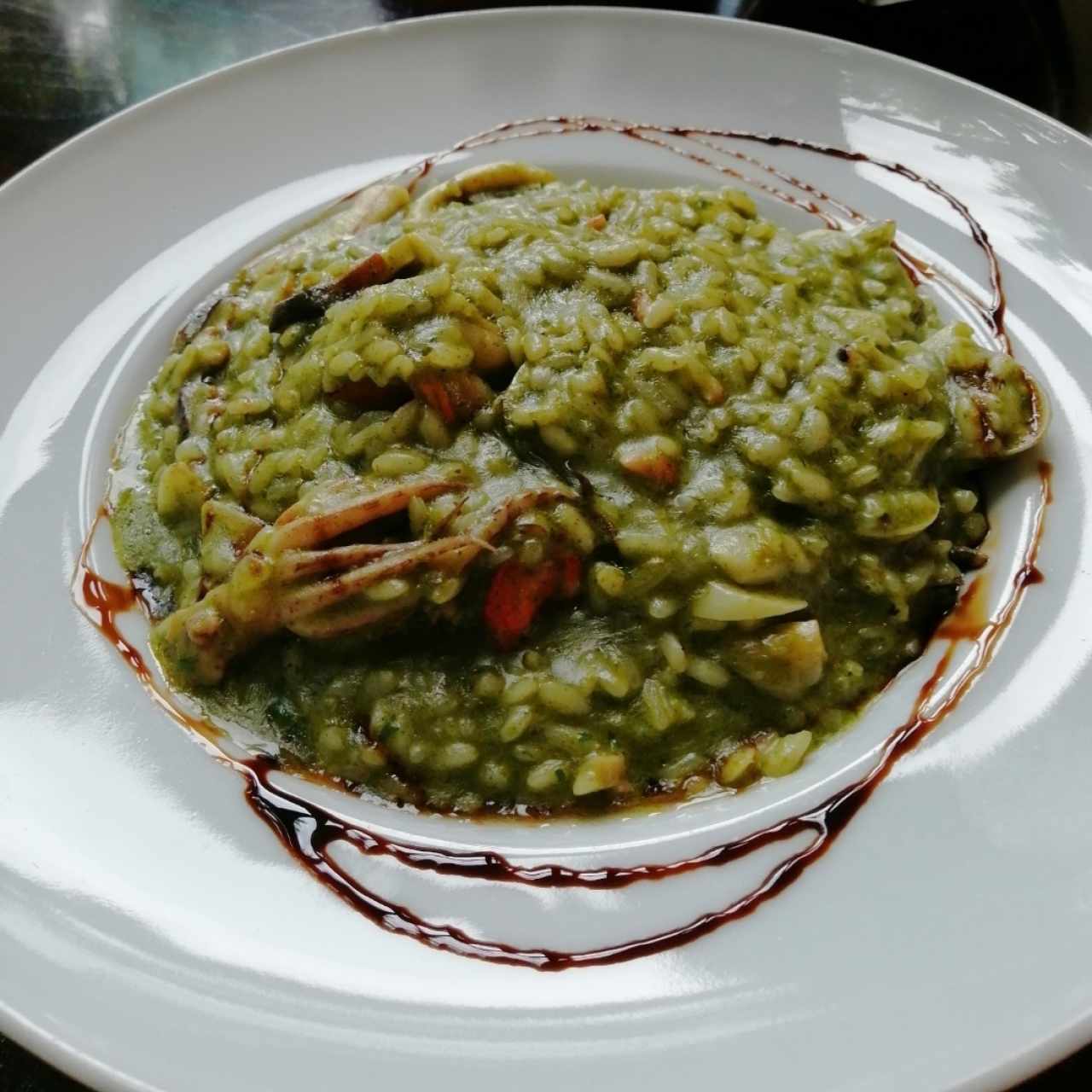 Risotto frutti di mare en salsa verde