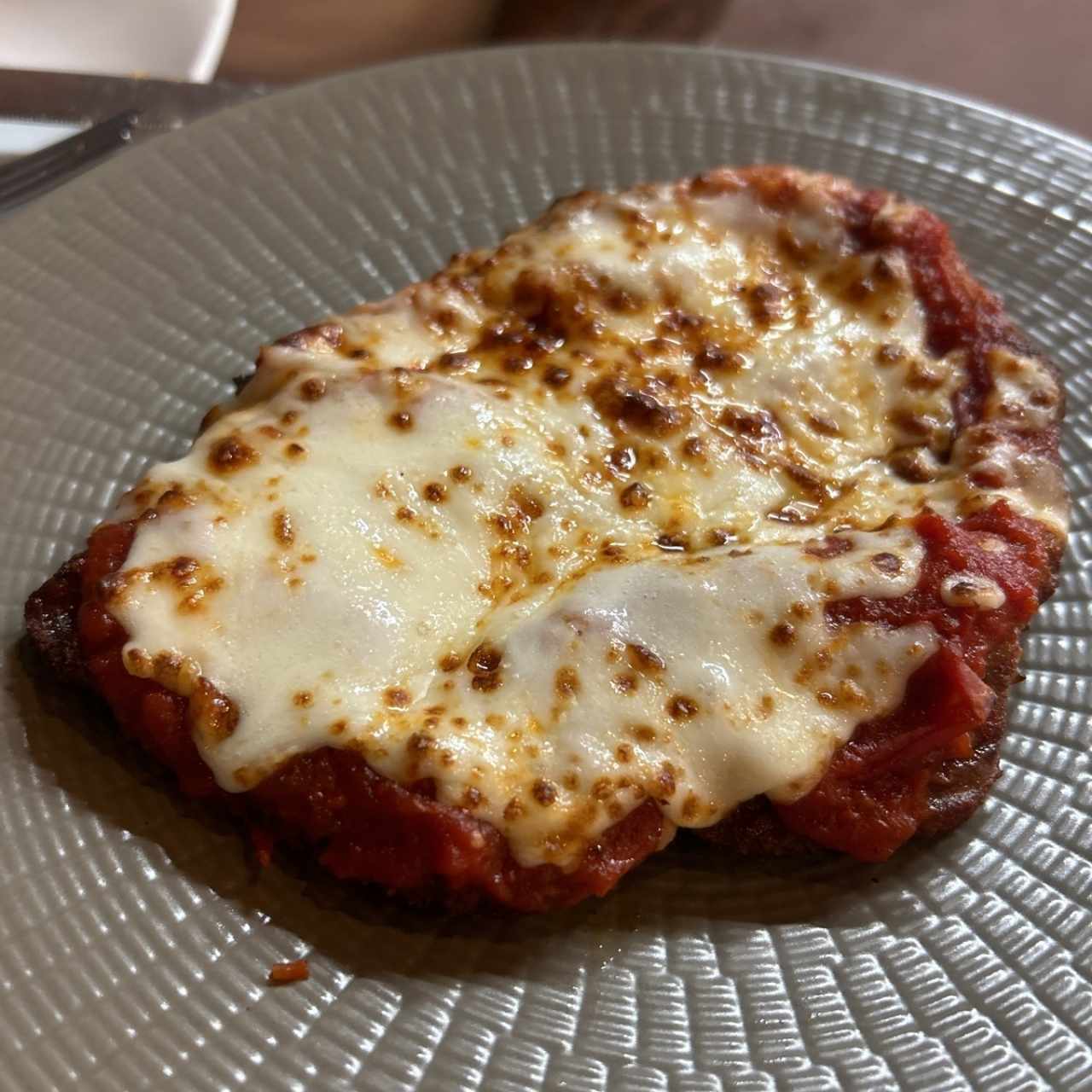 Milanesa de res parmesano