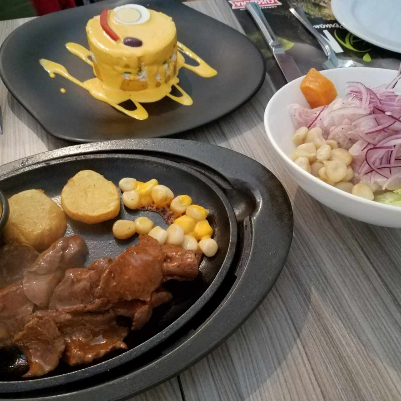 causa de pollo, anticucho de corazon y cebiche clasico