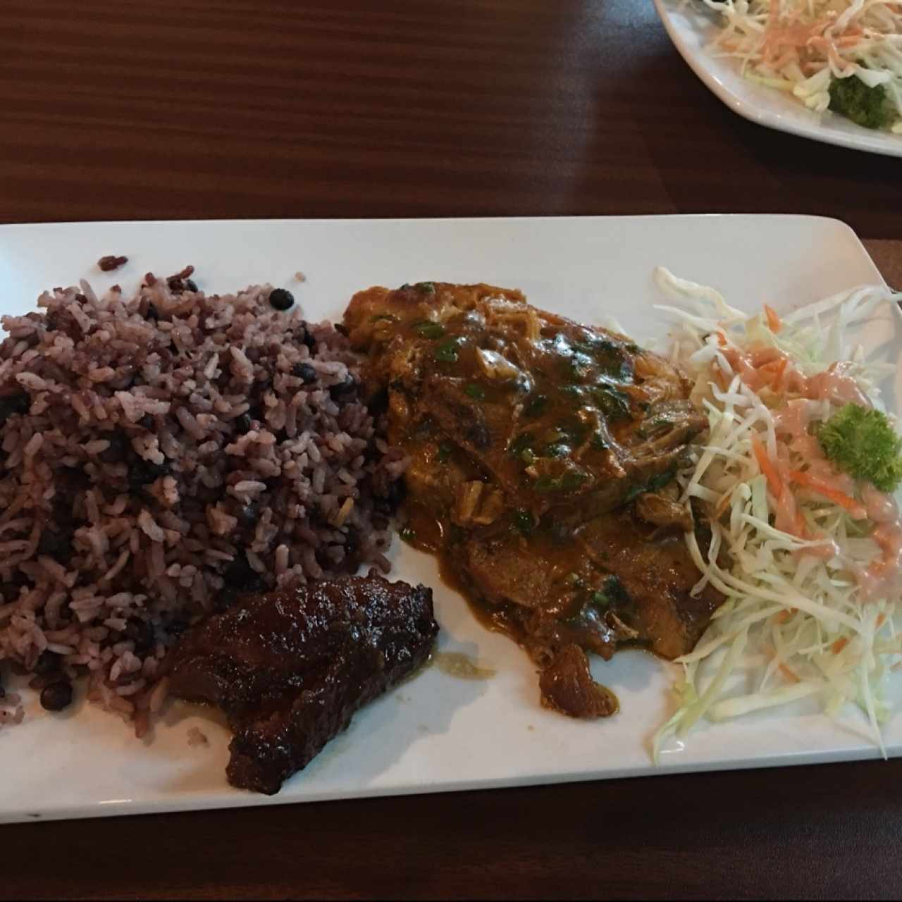 Puerco con culantro y ají arroz con guandú 