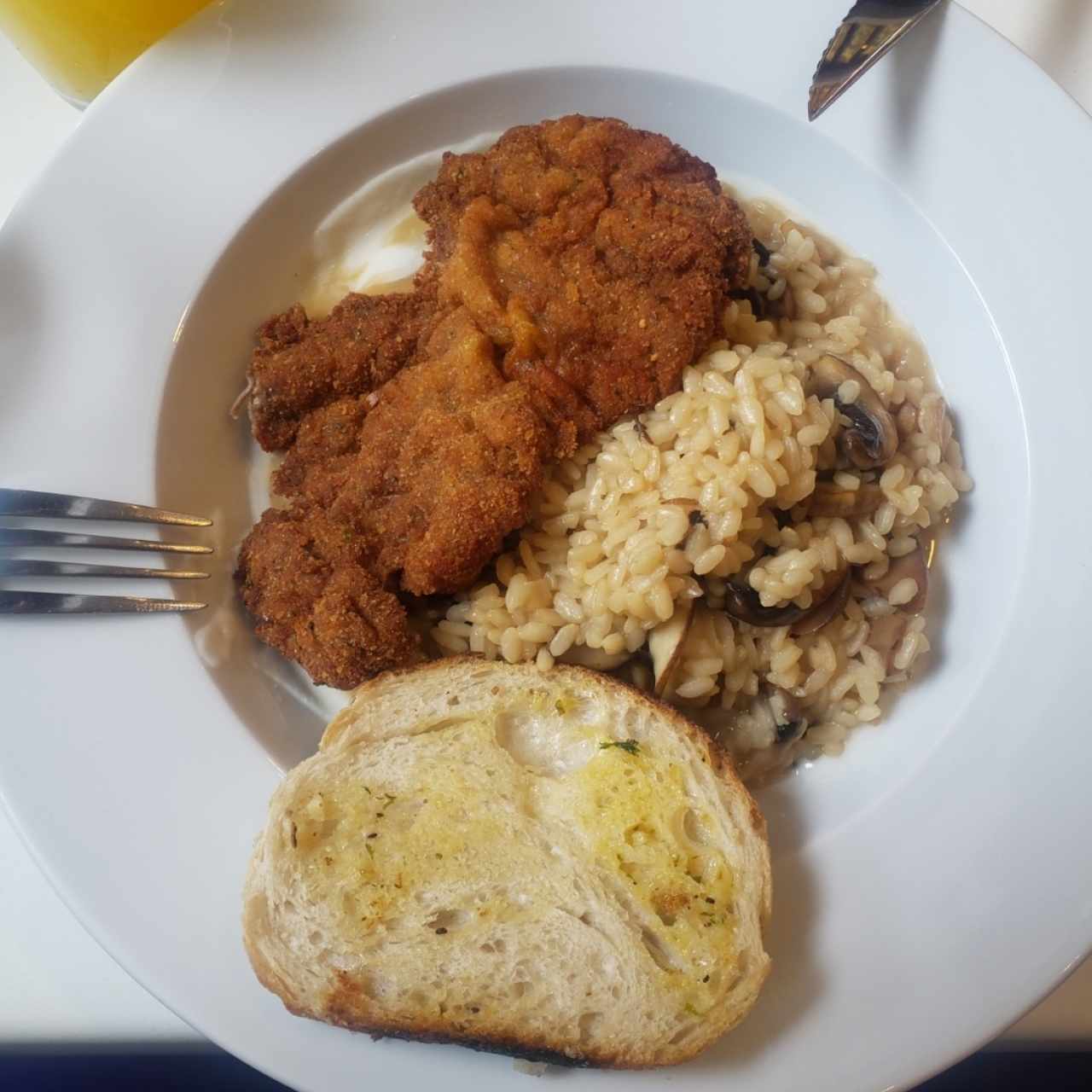 Risotto de fungi y bistec a la milanesa 😋