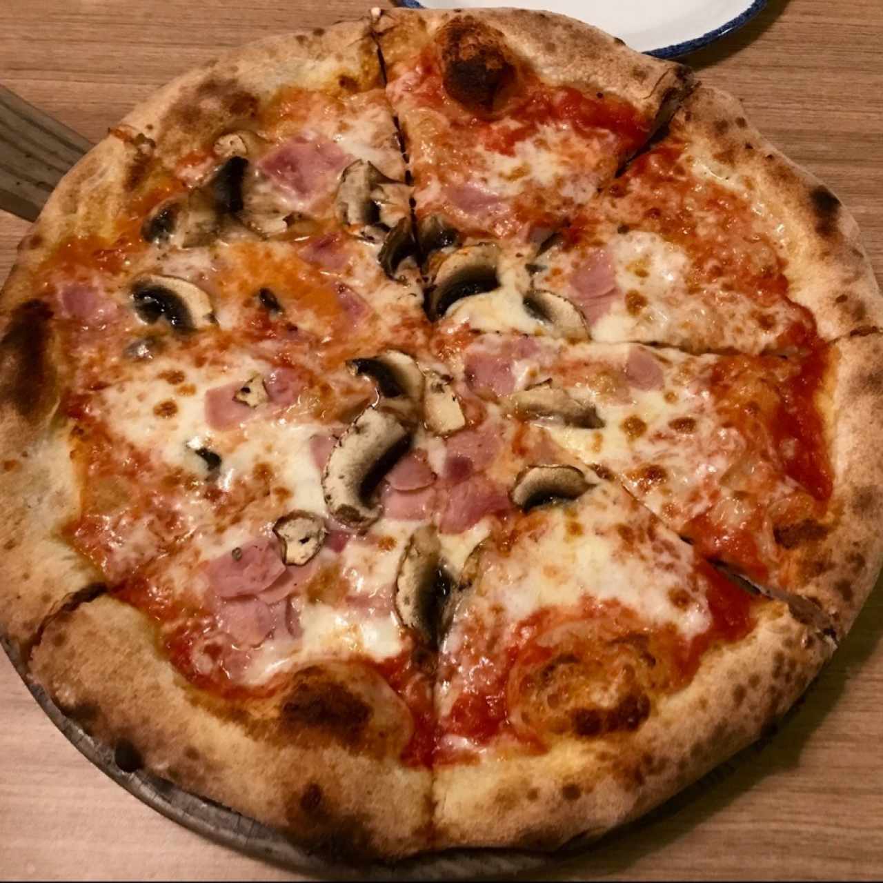 Pizza prosciutto y funghi