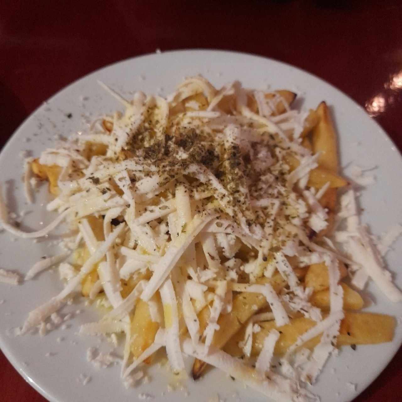 Papas fritas con queso y aceite de oliva