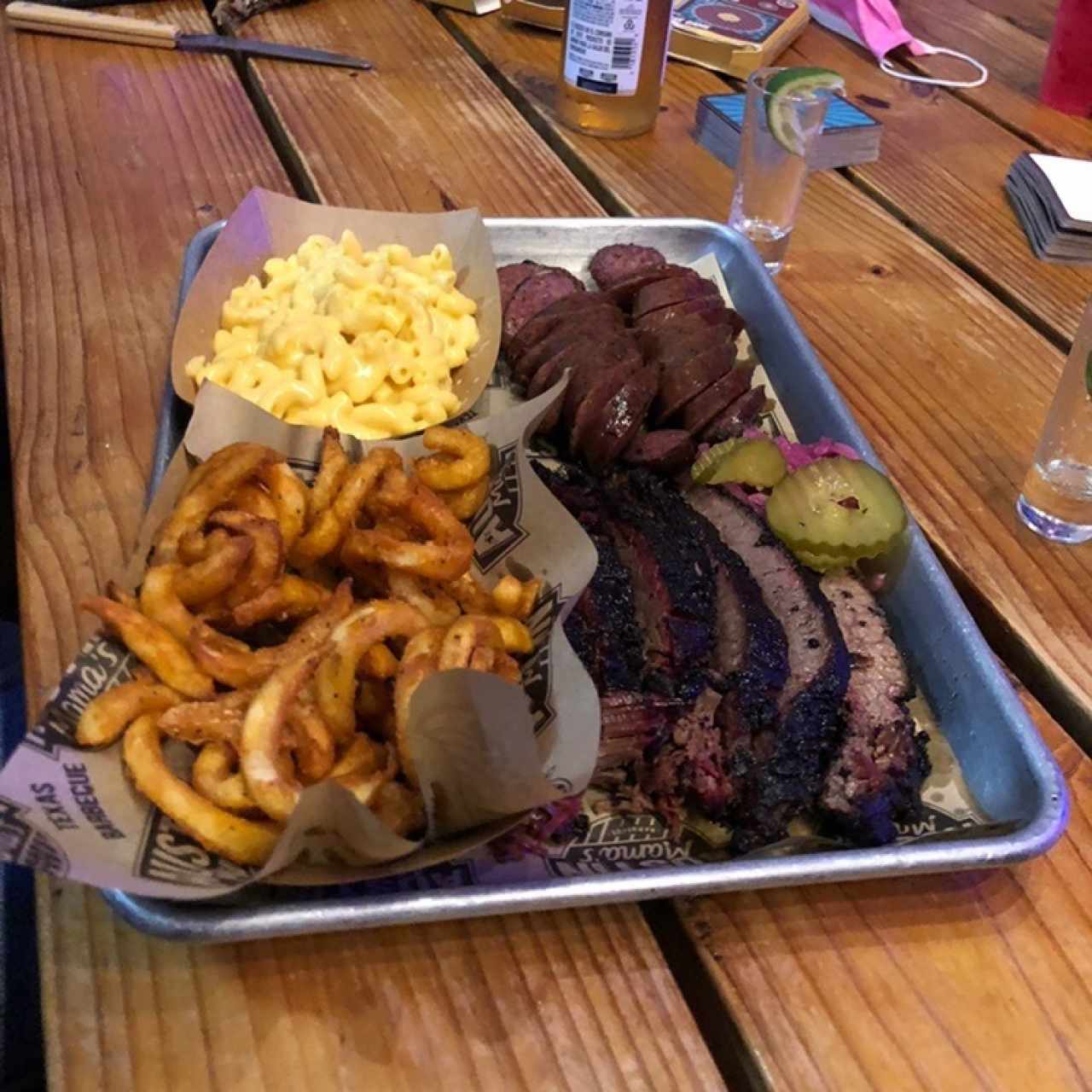 1/2 Lb Prime Brisket, sausage, mac & cheese, cajin curly fries