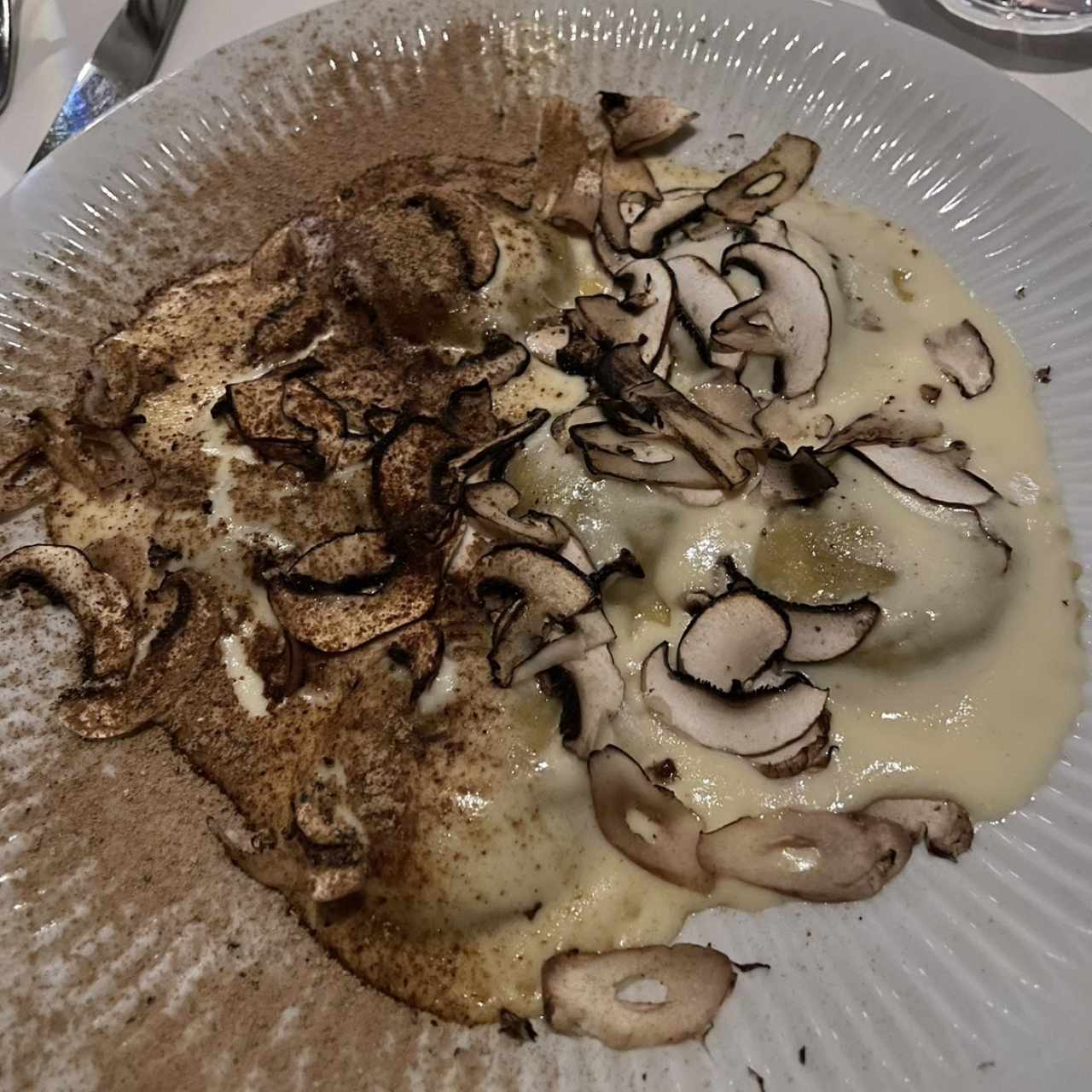 Raviolli Tondi de Hongos y Escargots