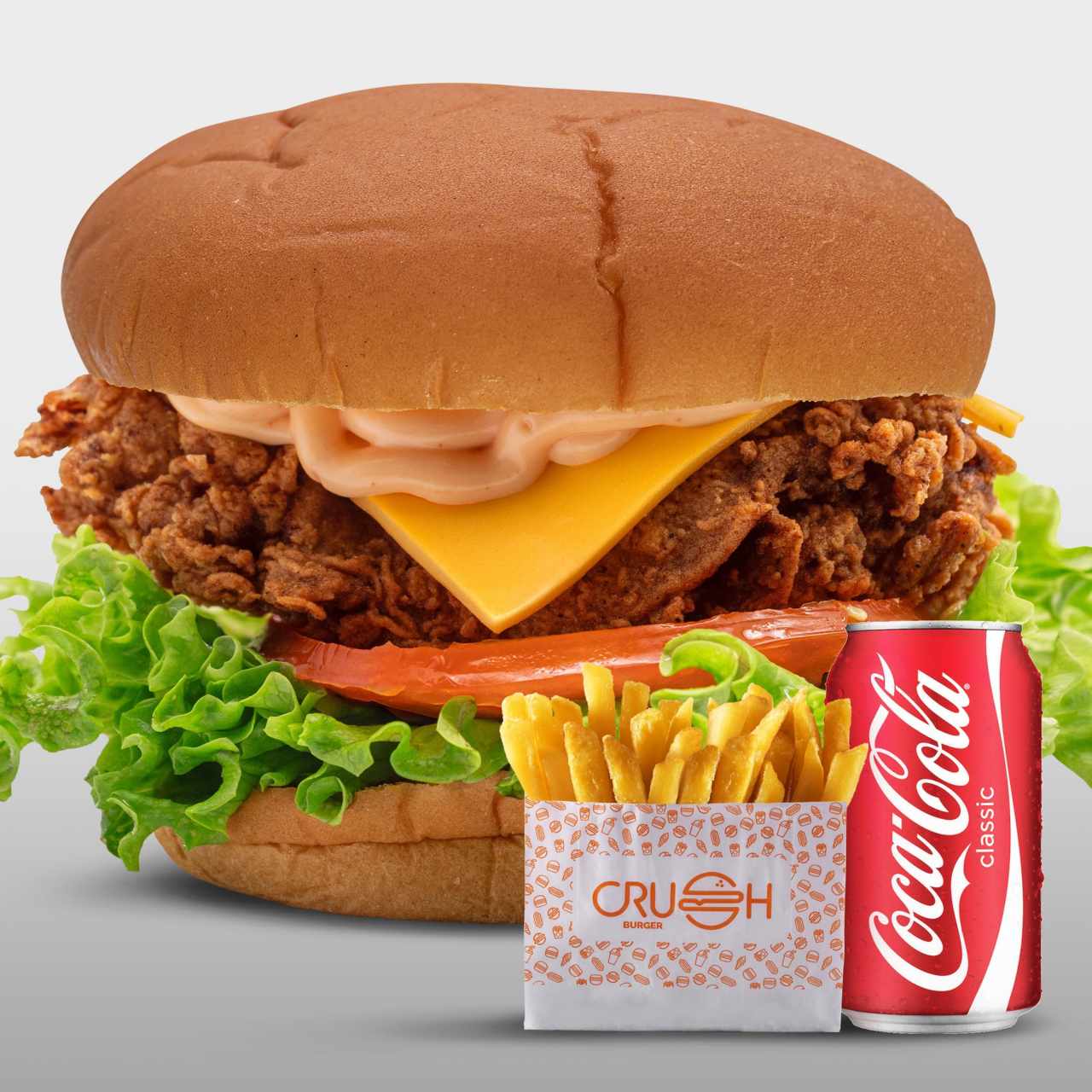 Spicy crispy chicken burger + papas + soda